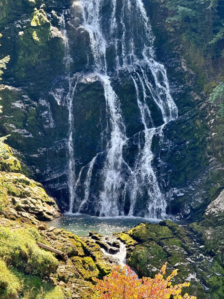 Close-up of Giessbach Waterfalls plunging into a rocky pool above Lake Brienz