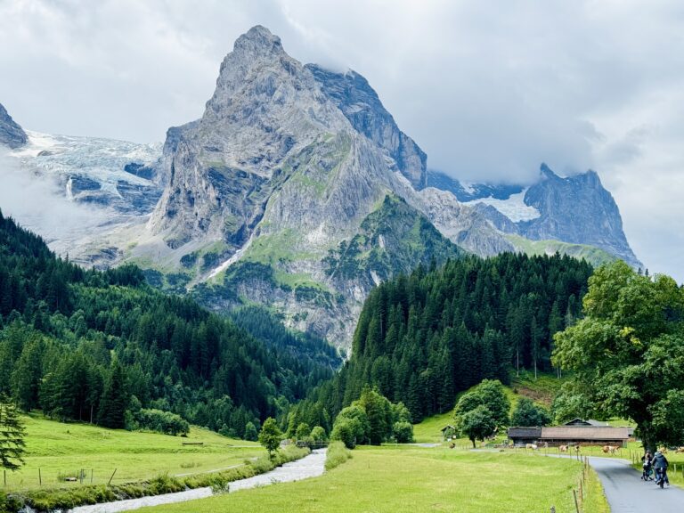 Scenic Rosenlaui Valley landscape with cyclists on the E-bike Tour from Interlaken