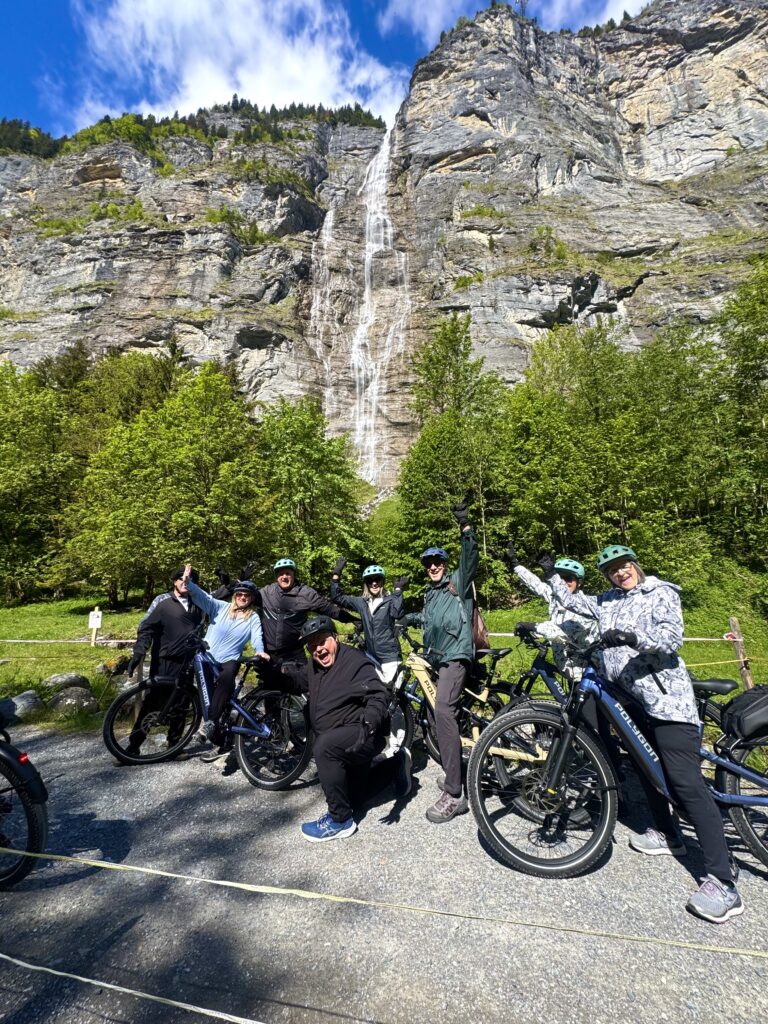 Happy riders visiting waterfalls in Lauterbrunnen Valley.