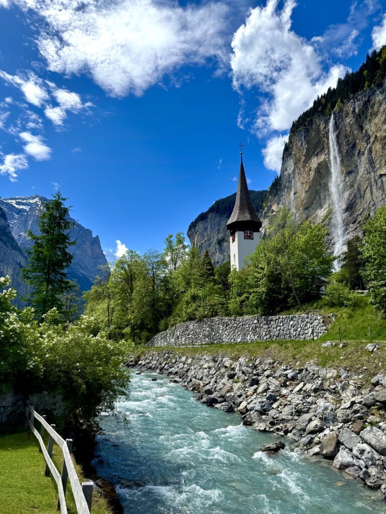 Lauterbrunnen church and Staubbach Falls in the Swiss Alps.